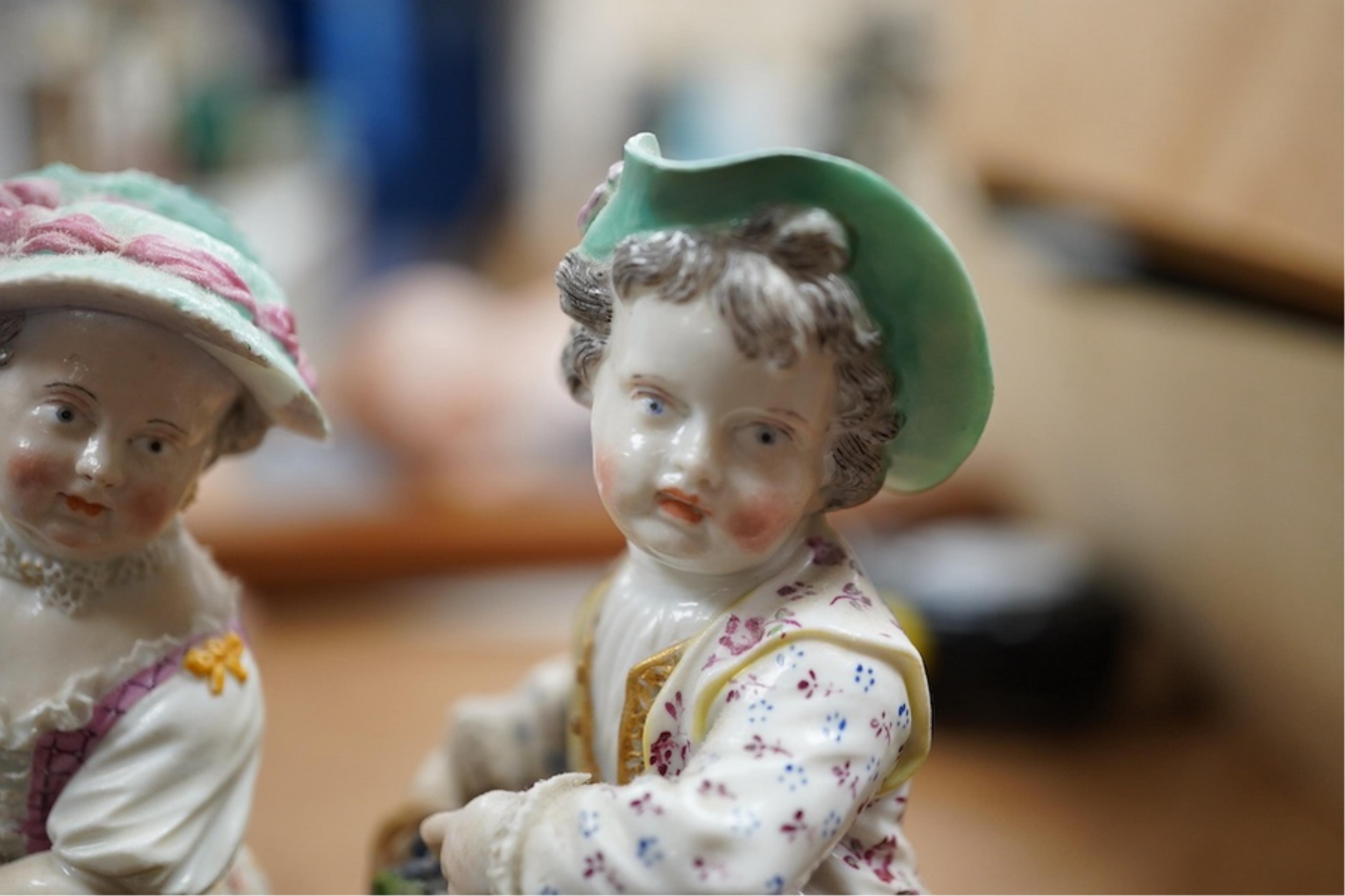 Two late 18th/early 19th century Meissen figures of children, 13cm high. Condition - fair